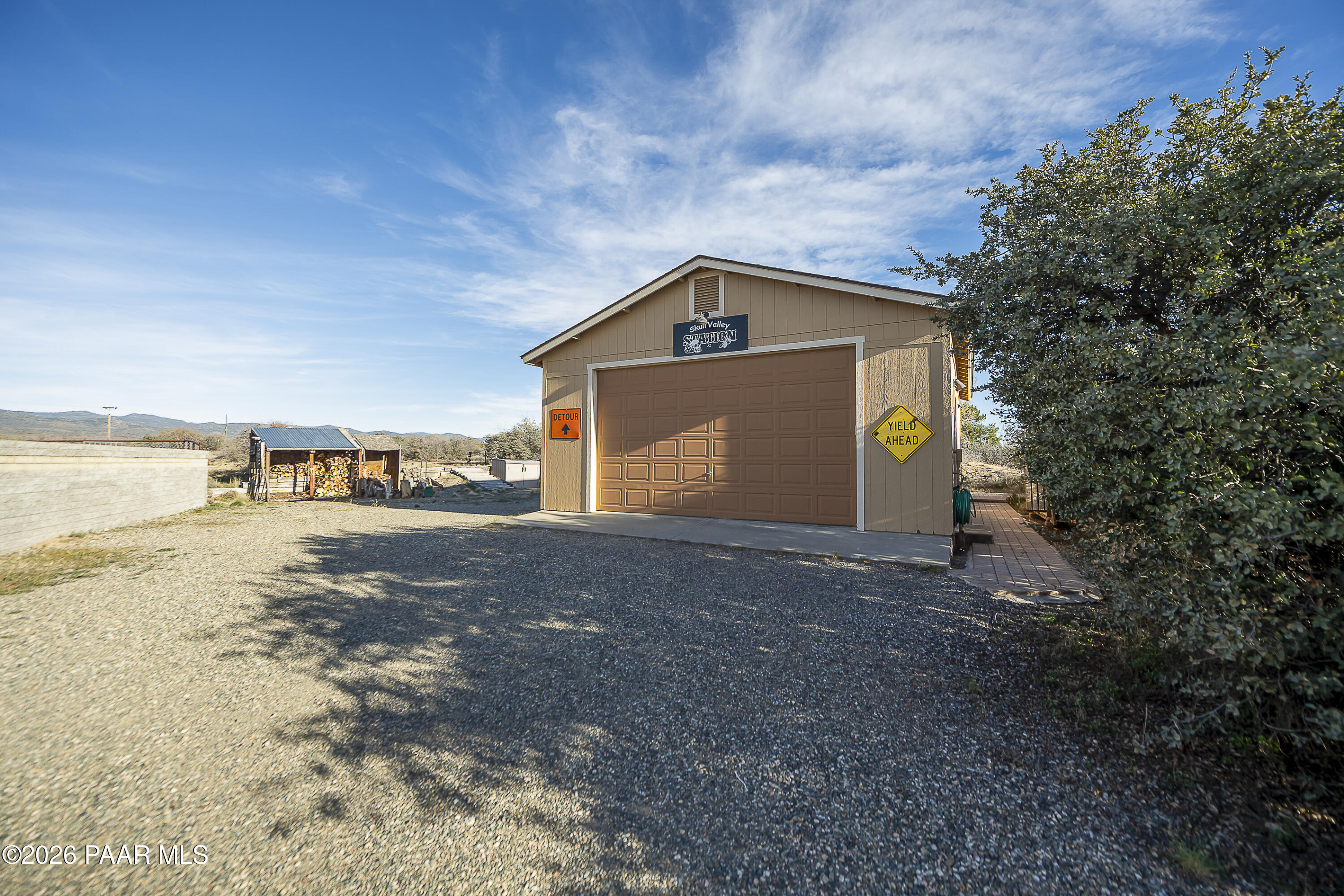 6565 Musgrove Road Skull Valley, AZ 86338 - Photo 46 of 65 a view of a house with a yard
