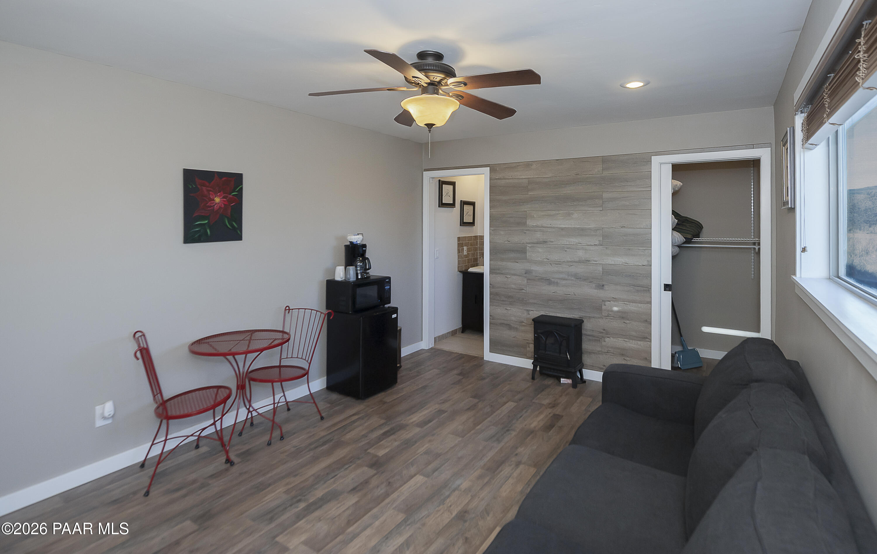 6565 Musgrove Road Skull Valley, AZ 86338 - Photo 53 of 65 a living room with furniture and a fireplace