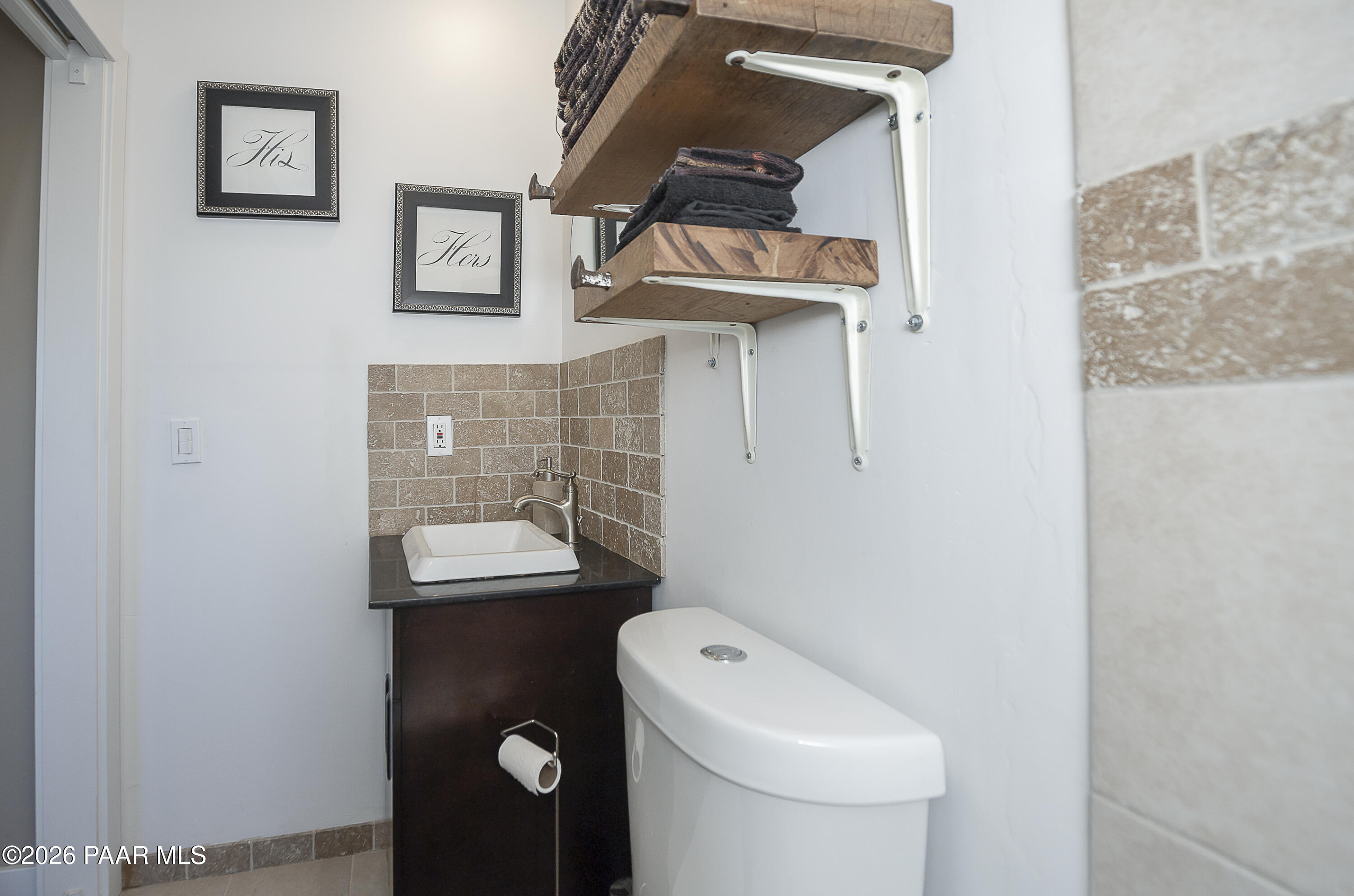 6565 Musgrove Road Skull Valley, AZ 86338 - Photo 55 of 65 a bathroom with a toilet and a sink