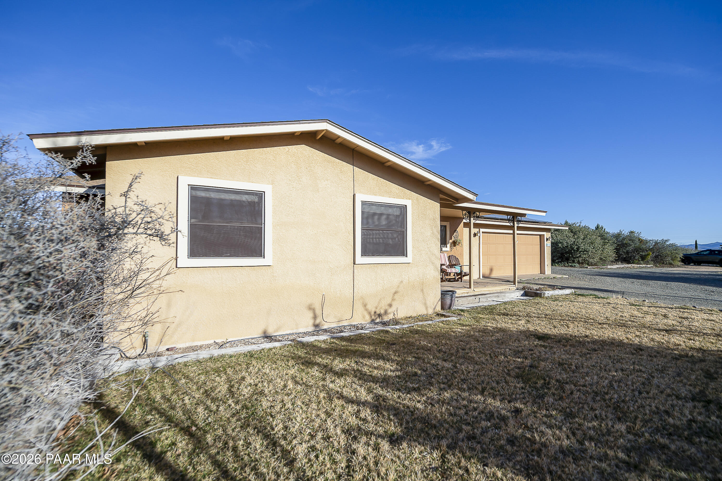 6565 Musgrove Road Skull Valley, AZ 86338 - Photo 60 of 65 a view of a house with backyard