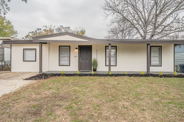front view of a house with a yard