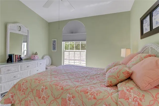 a view of a bedroom with furniture