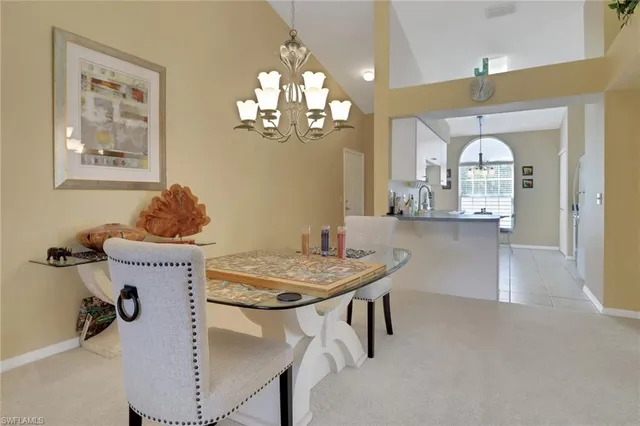 a living room with furniture a flat screen tv and a large window