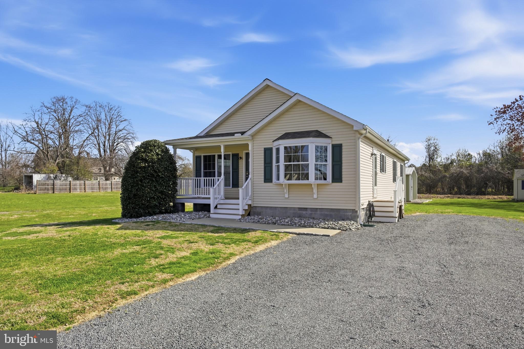 5883 Williams Street Rock Hall, MD 21661 - Photo 1 of 1 a view of a house with a yard and sitting area
