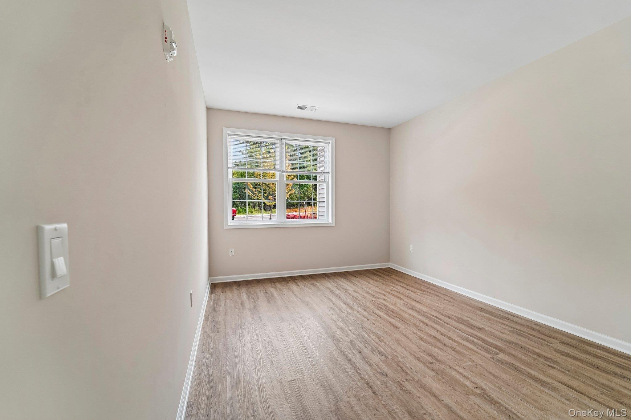 414 Tower Ridge Circle Middletown, NY 10941 - Photo 8 of 13 Neutral-toned interior featuring wood-finish flooring and a white trim package