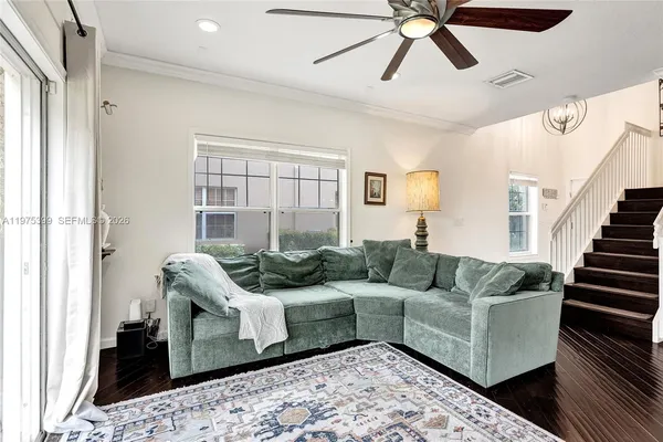 a living room with furniture and a large window