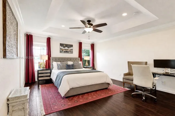 a spacious bedroom with a bed and a desk