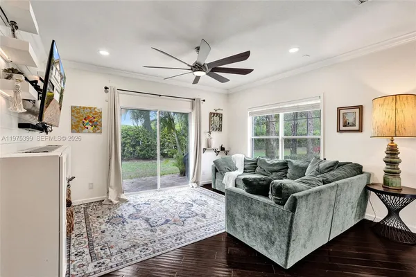 a living room with furniture and a window