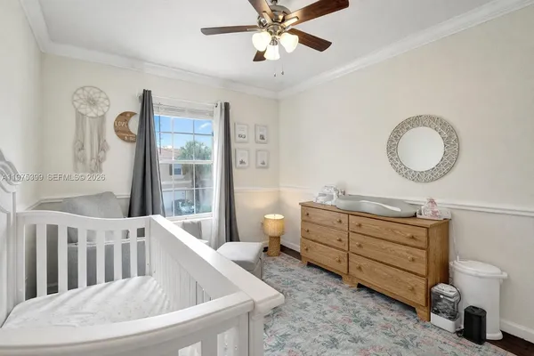 a bedroom with furniture and a chandelier