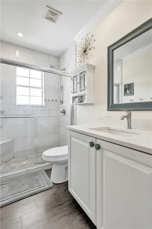 a close view of a sink and a stove in a kitchen