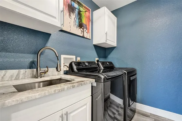 a utility room with dryer and washer