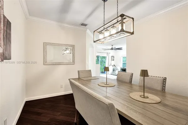 a dining room with wooden floor and breakfast area