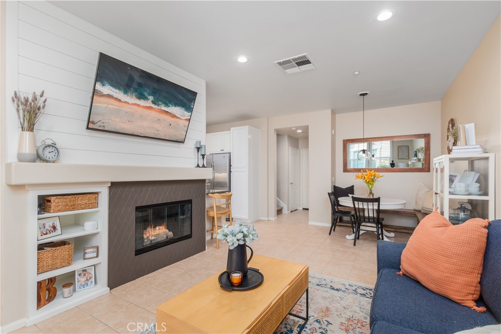 30505 Canyon Hills Road, Unit 1905 Lake Elsinore, CA 92532 - Photo 1 of 1 a living room with furniture and a fireplace