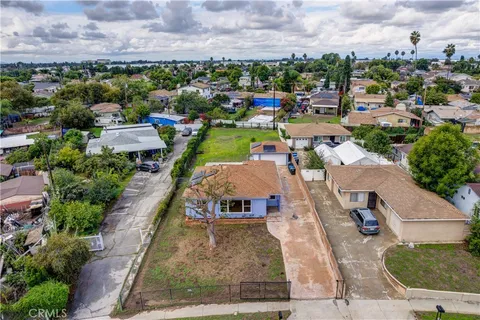 an aerial view of a house with a garden