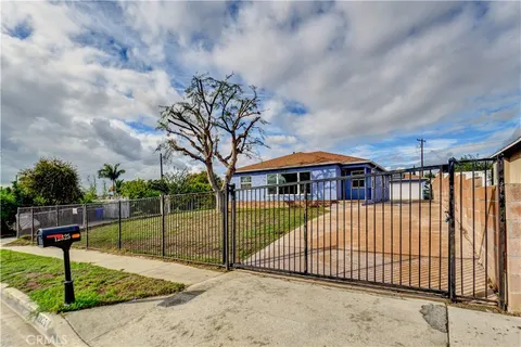a view of a wrought iron fences in front of house