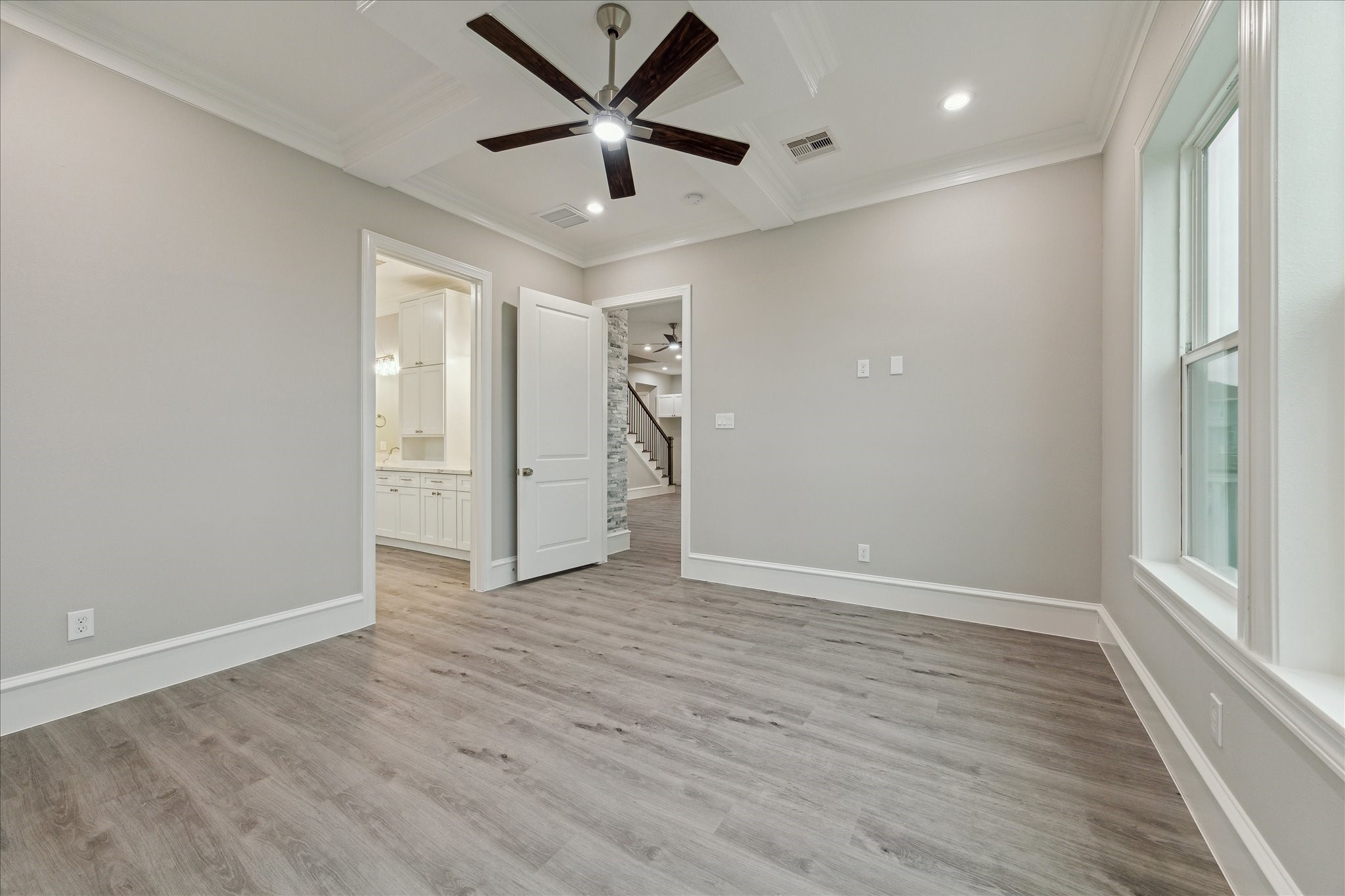 14 Fleming Hitchcock, TX 77563 - Photo 21 of 50 an empty room with wooden floor and a ceiling fan