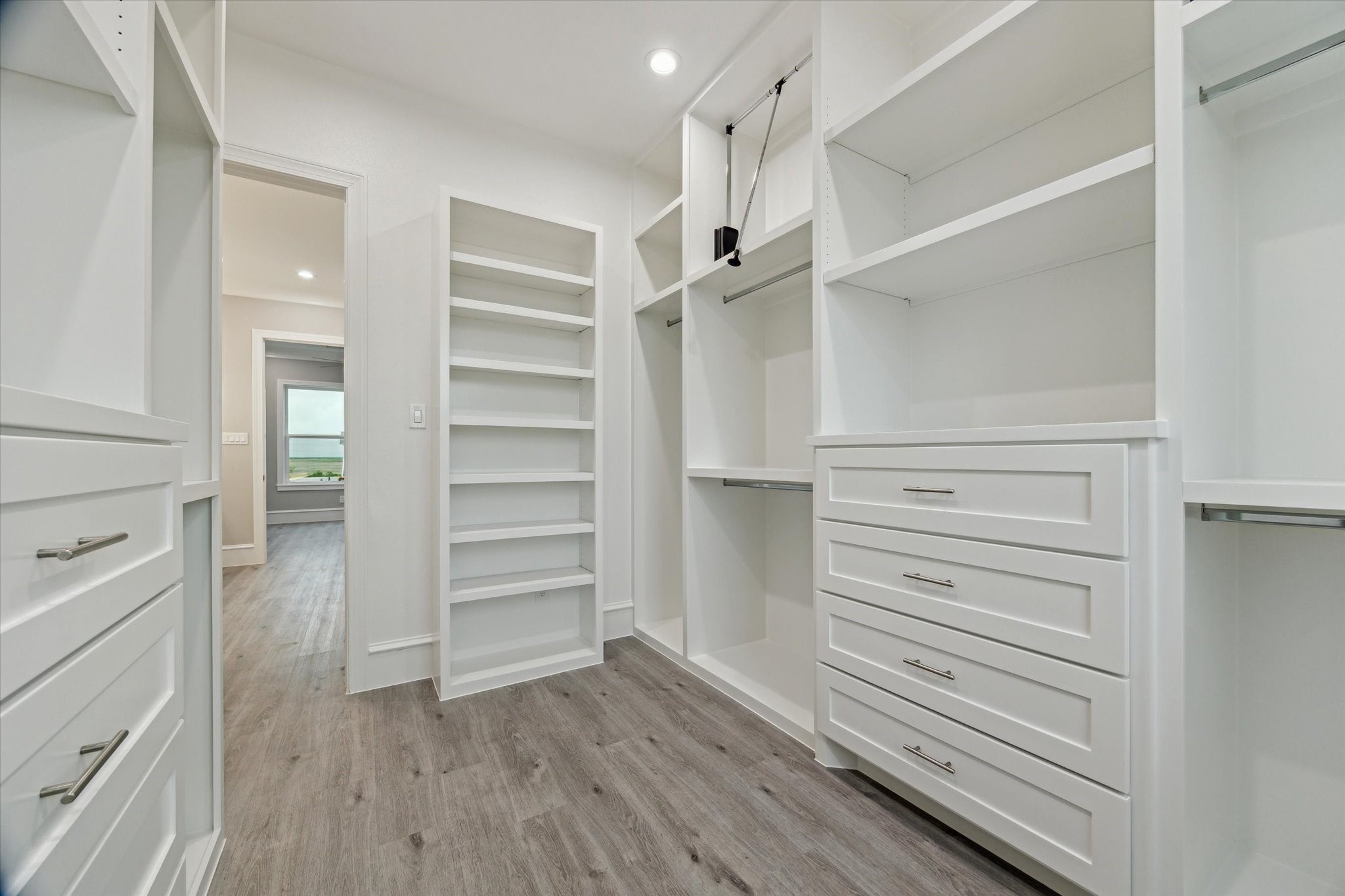 14 Fleming Hitchcock, TX 77563 - Photo 27 of 50 a view of walk in closet with empty racks