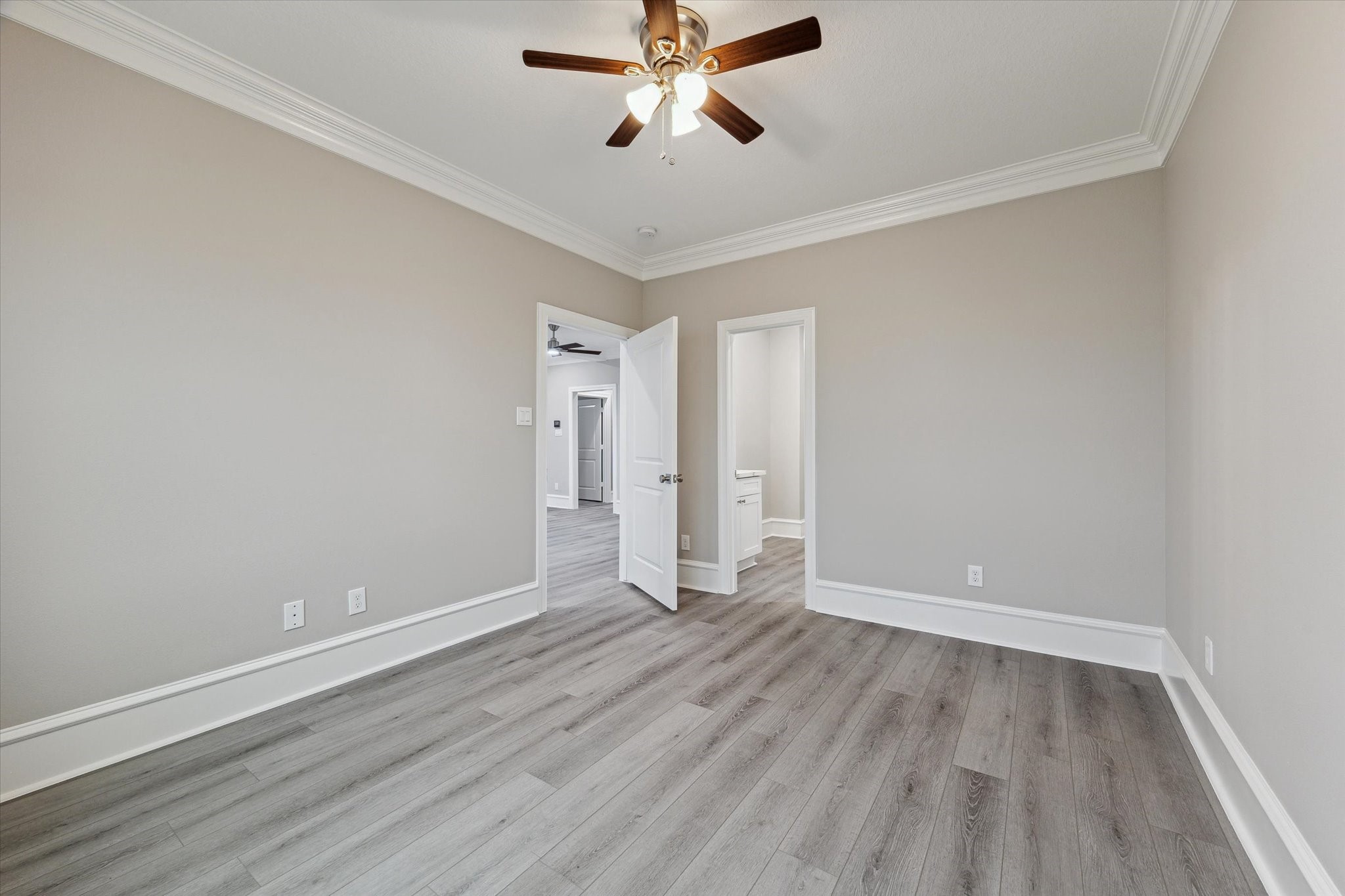 14 Fleming Hitchcock, TX 77563 - Photo 42 of 50 an empty room with wooden floor ceiling fan and windows