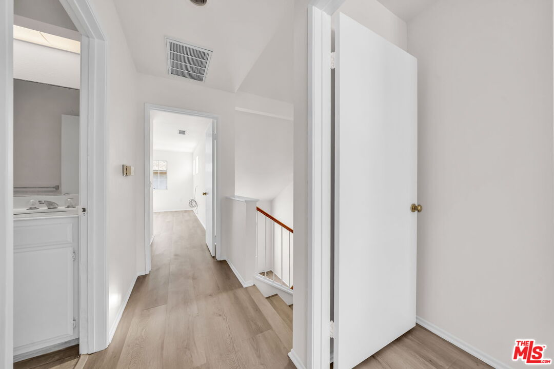 820 West Compton Boulevard, Unit 17 Compton, CA 90220 - Photo 32 of 50 a view of a hallway with a wooden floor