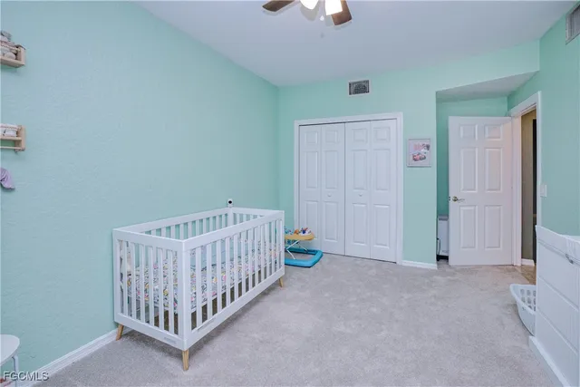 a view of a bedroom with wooden floor