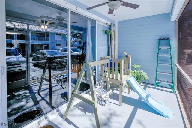 a view of a chairs and table in a patio