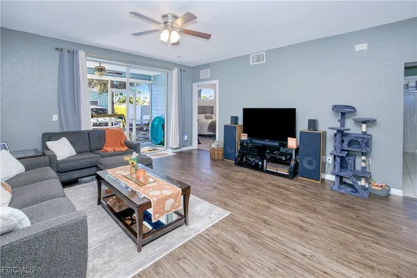 a living room with furniture and a flat screen tv