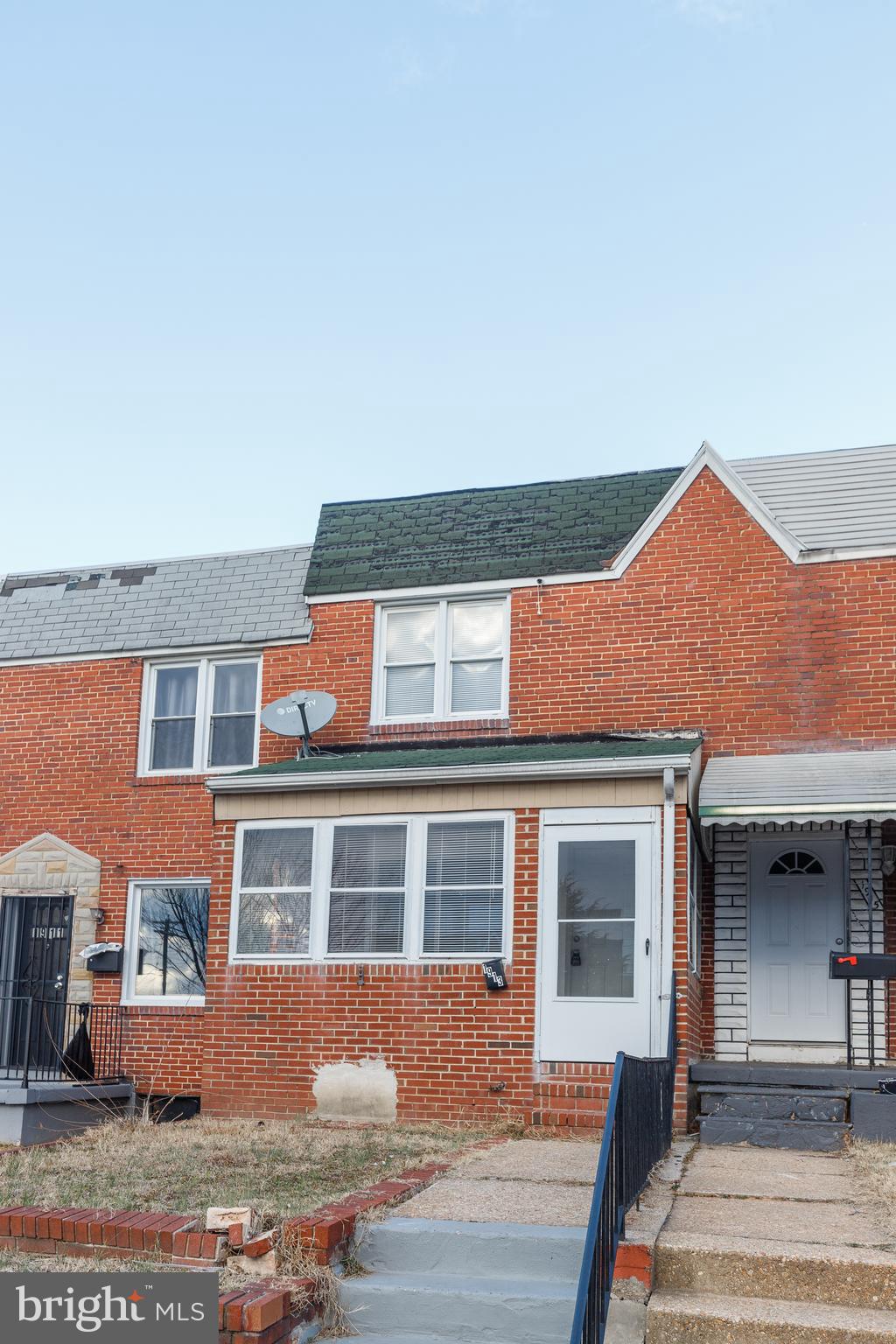 1913 Harman Avenue Baltimore, MD 21230 - Photo 24 of 41 a front view of a house with a yard