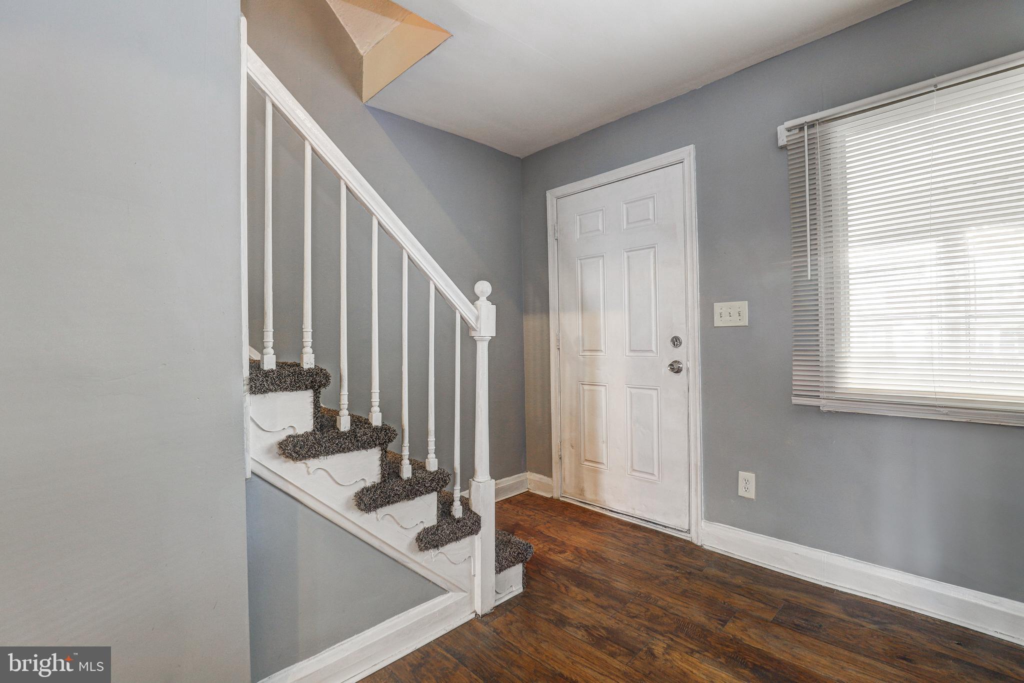 1913 Harman Avenue Baltimore, MD 21230 - Photo 6 of 41 a view of a hallway with entryway and wooden floor