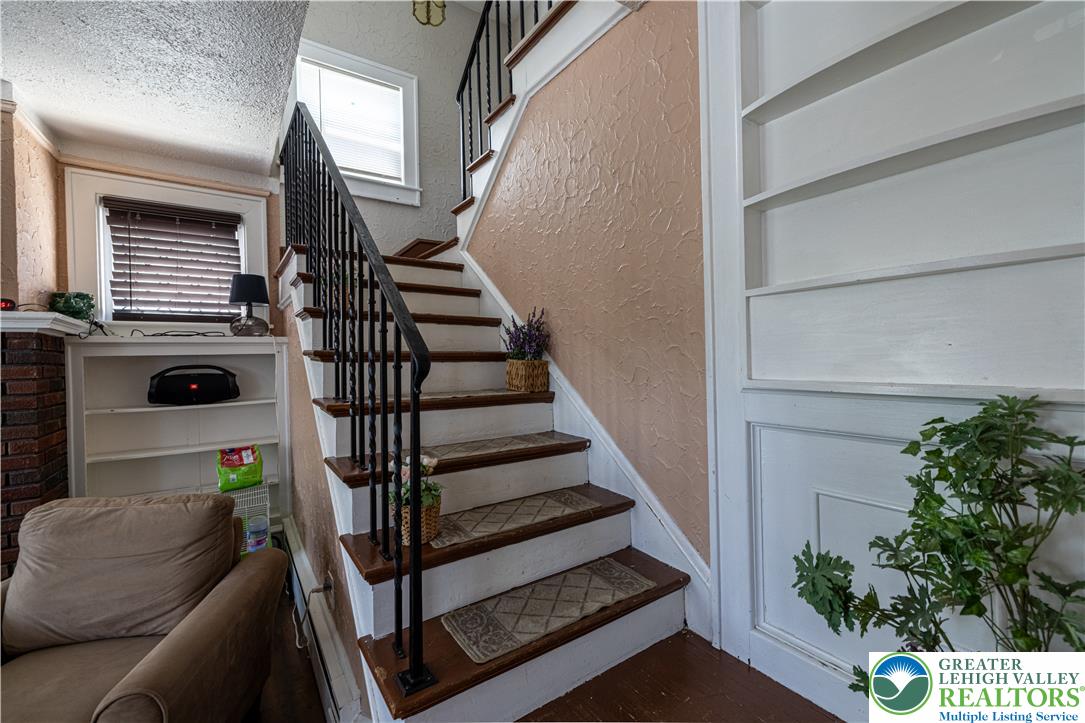 118 South 3rd Street Bangor, PA 18013 - Photo 13 of 33 This interior staircase offers a warm welcome to comfortable living spaces.