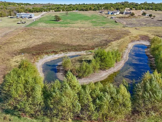 a view of a lake with a big yard