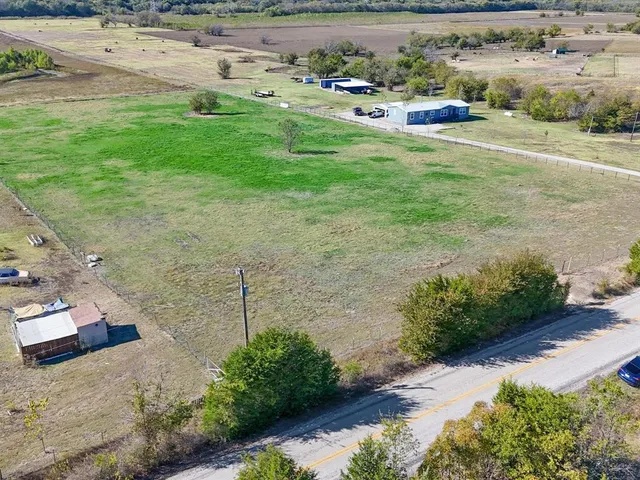 an aerial view of balcony with tall buildings