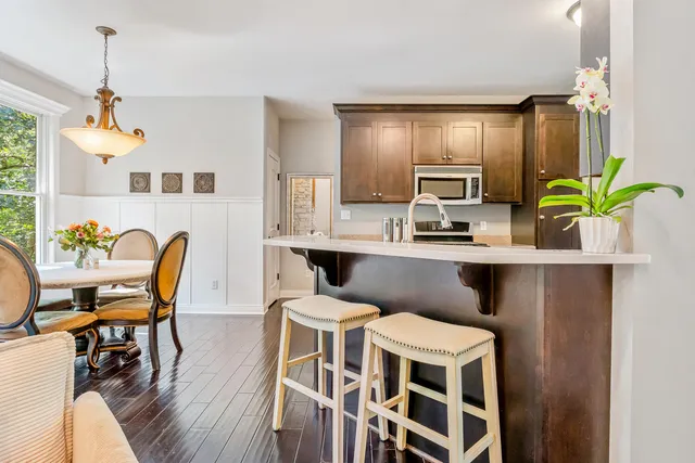 a bedroom with furniture and a large window