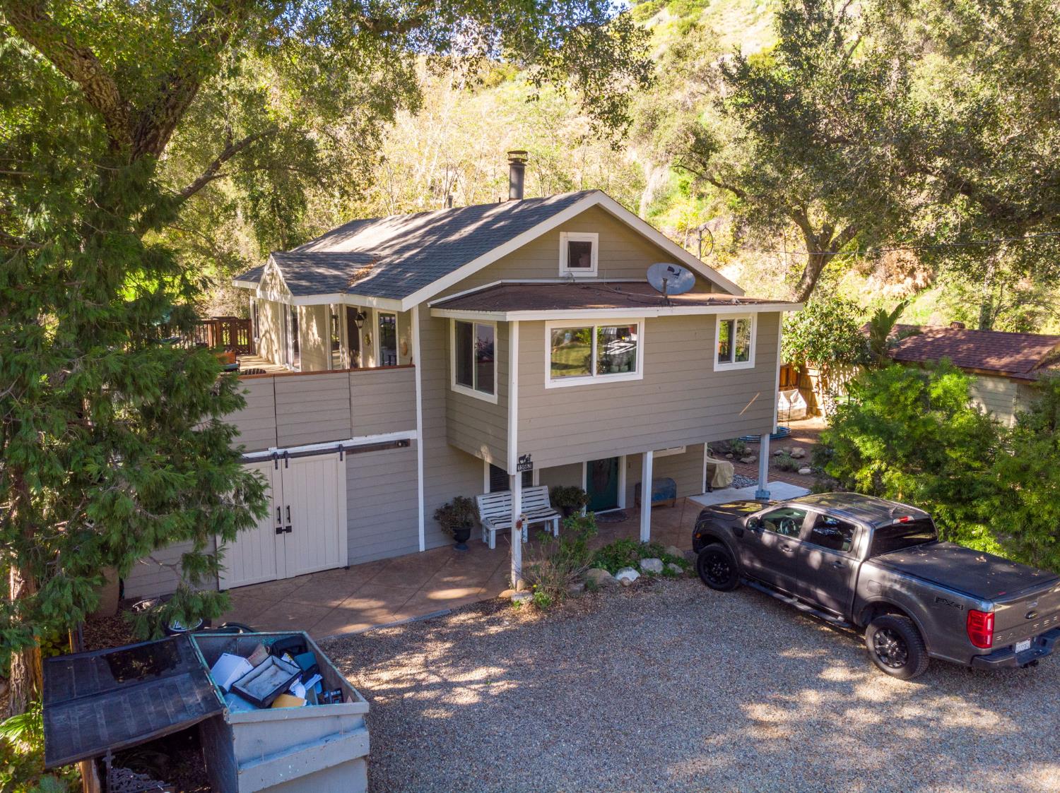 15663 Ojai Road Santa Paula, CA 93060 - Photo 2 of 47 a front view of a house with cars parked