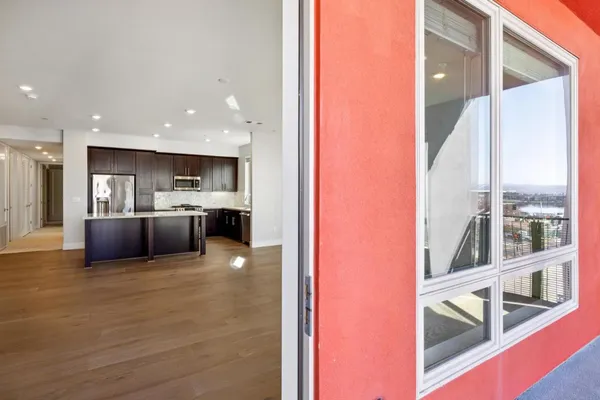 a kitchen with stainless steel appliances wooden cabinets and a stove top oven