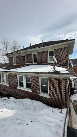 a front view of a house with a garage