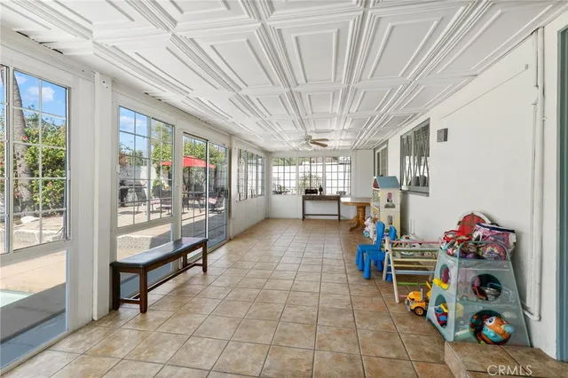 a hallway with toys and flowers