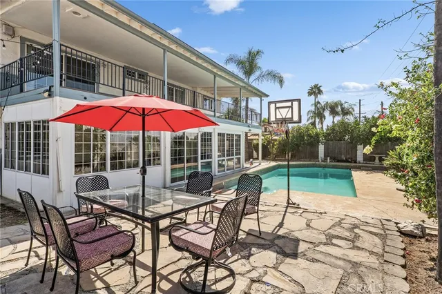 a view of a chairs and table in the patio