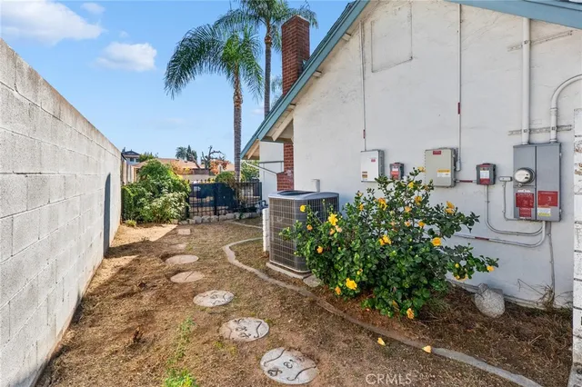 a view of a house with pool and chairs