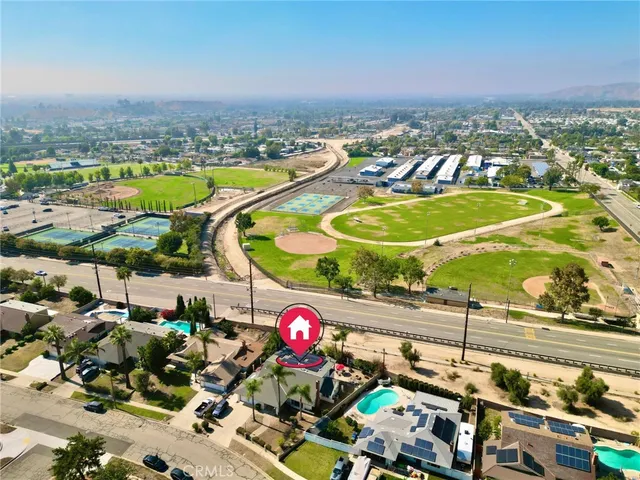 an aerial view of residential houses with outdoor space