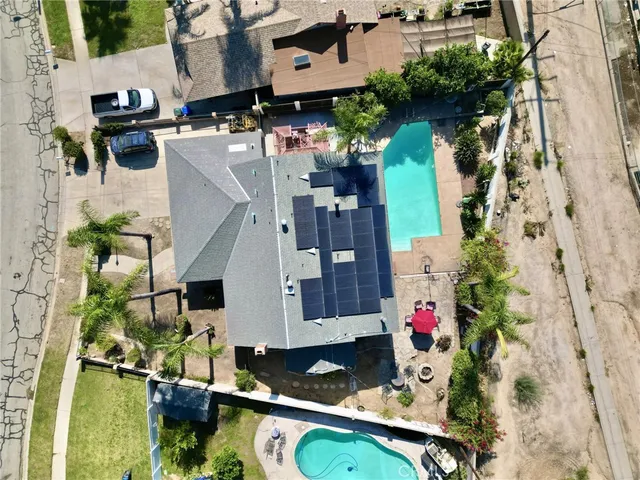 an aerial view of multiple houses with outdoor space