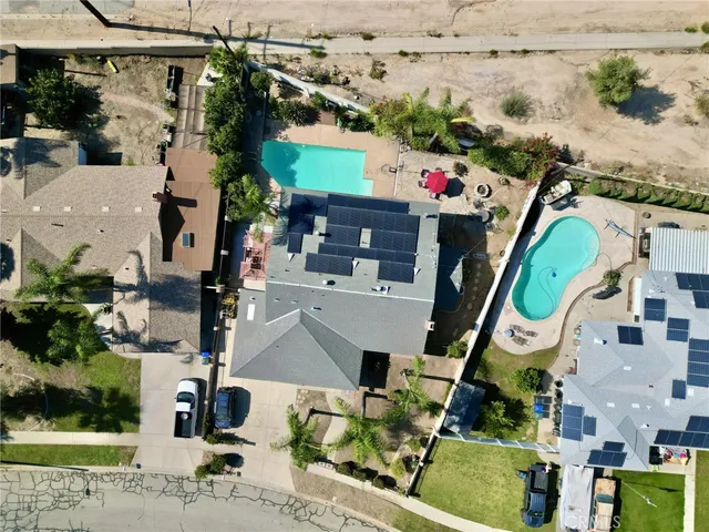 an aerial view of house with yard