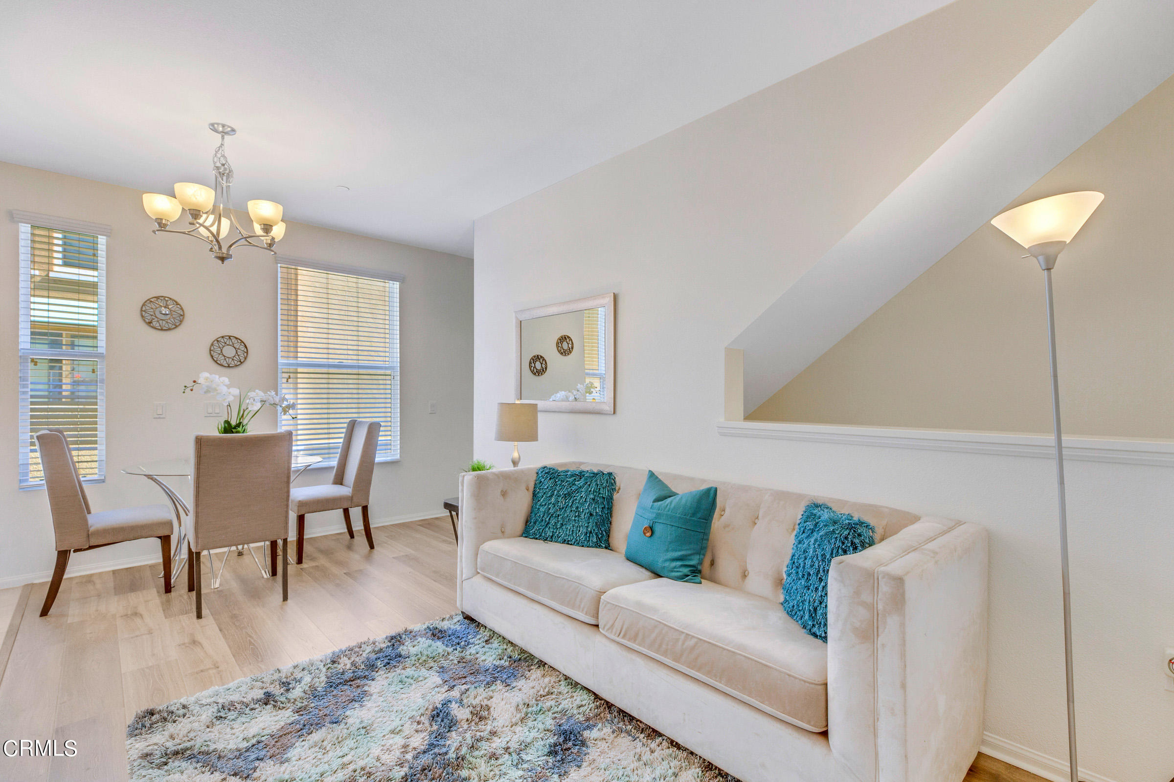 410 West Main Street, Unit 231 Alhambra, CA 91801 - Photo 17 of 45 a living room with furniture wooden floor and a chandelier