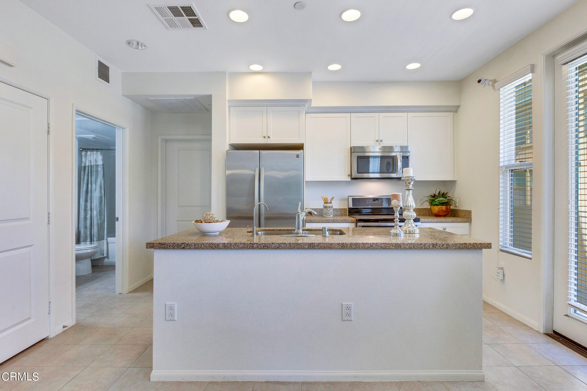 410 West Main Street, Unit 231 Alhambra, CA 91801 - Photo 19 of 45 a large kitchen with granite countertop a large counter top stainless steel appliances and cabinets