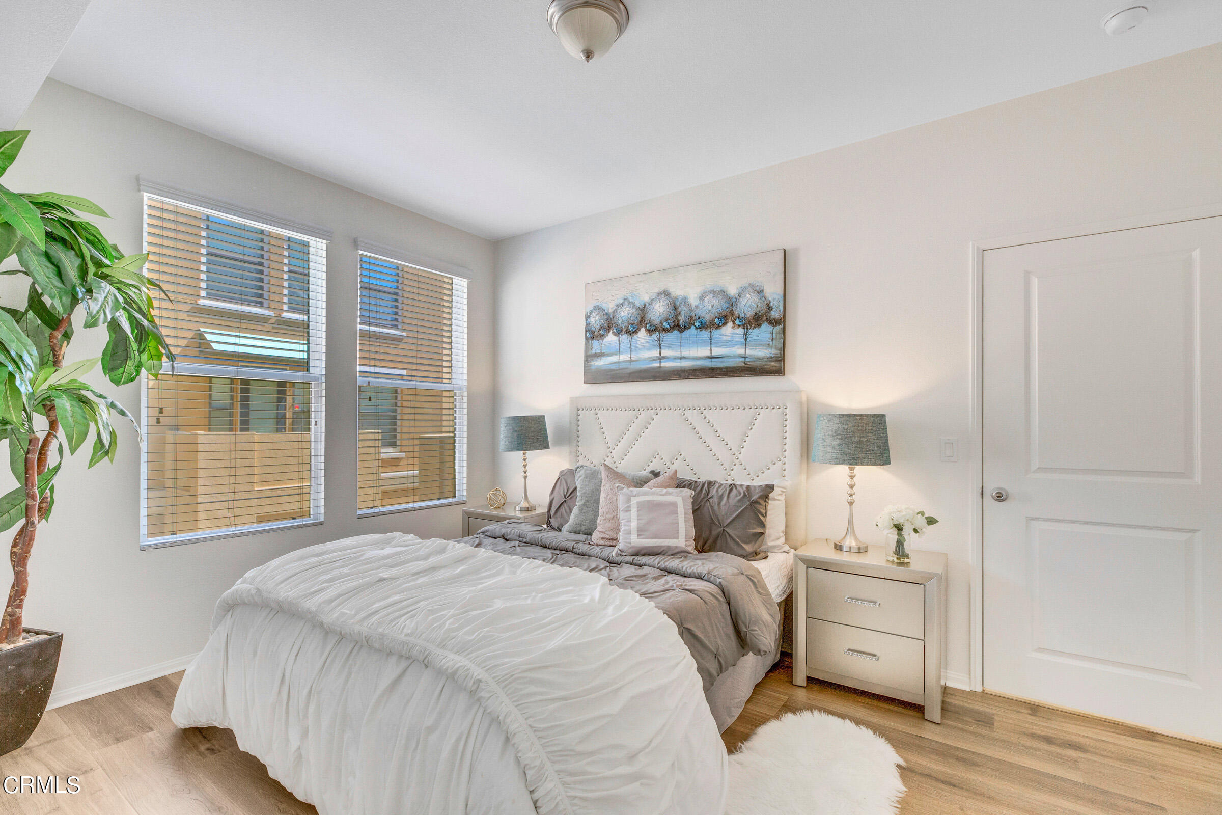 410 West Main Street, Unit 231 Alhambra, CA 91801 - Photo 26 of 45 a bedroom with a bed and wooden floor