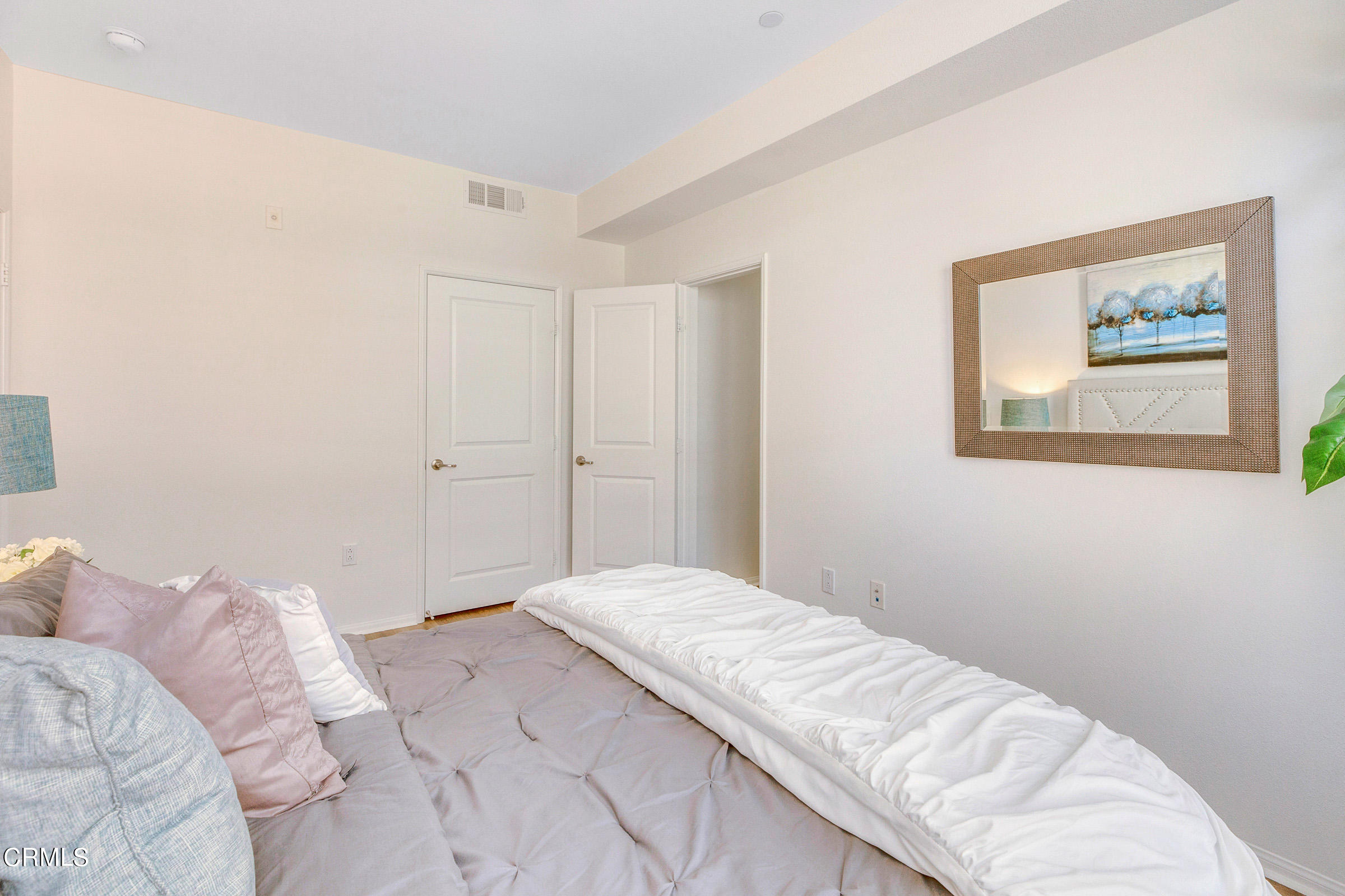410 West Main Street, Unit 231 Alhambra, CA 91801 - Photo 27 of 45 a bedroom with a bed and hallway