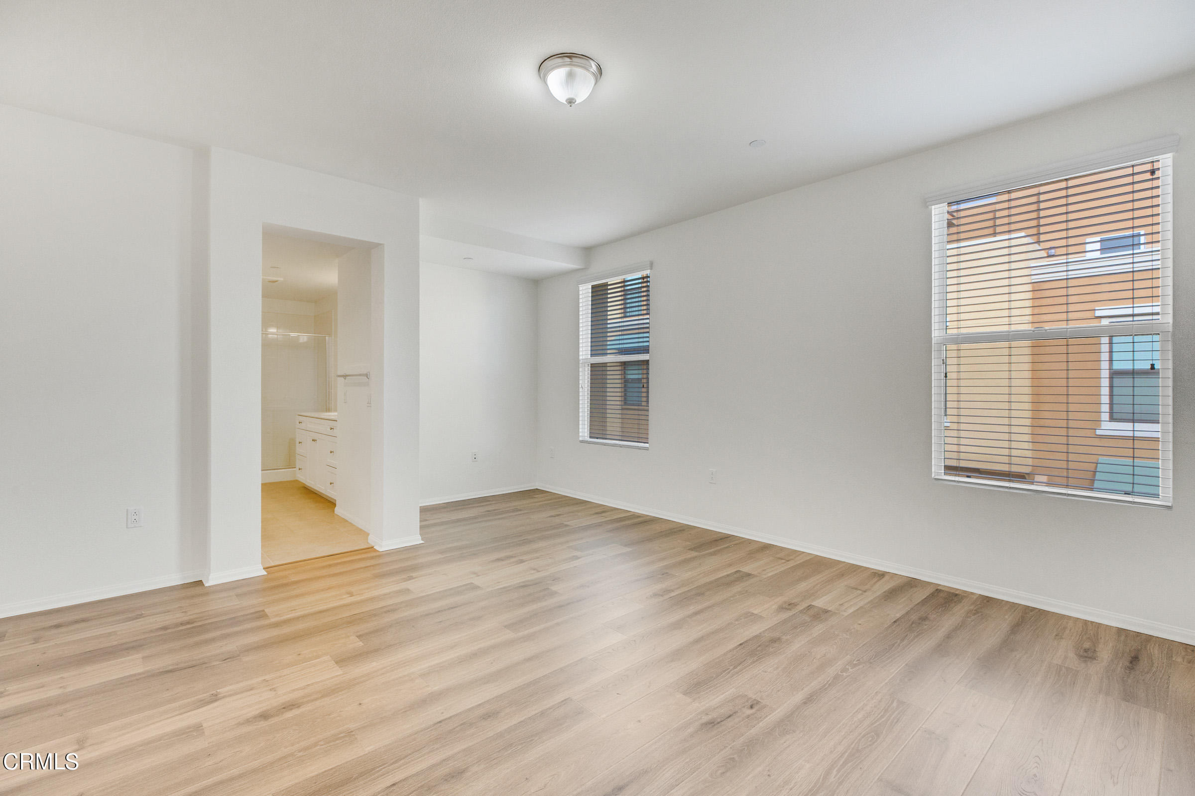 410 West Main Street, Unit 231 Alhambra, CA 91801 - Photo 34 of 45 a view of an empty room with wooden floor and a window