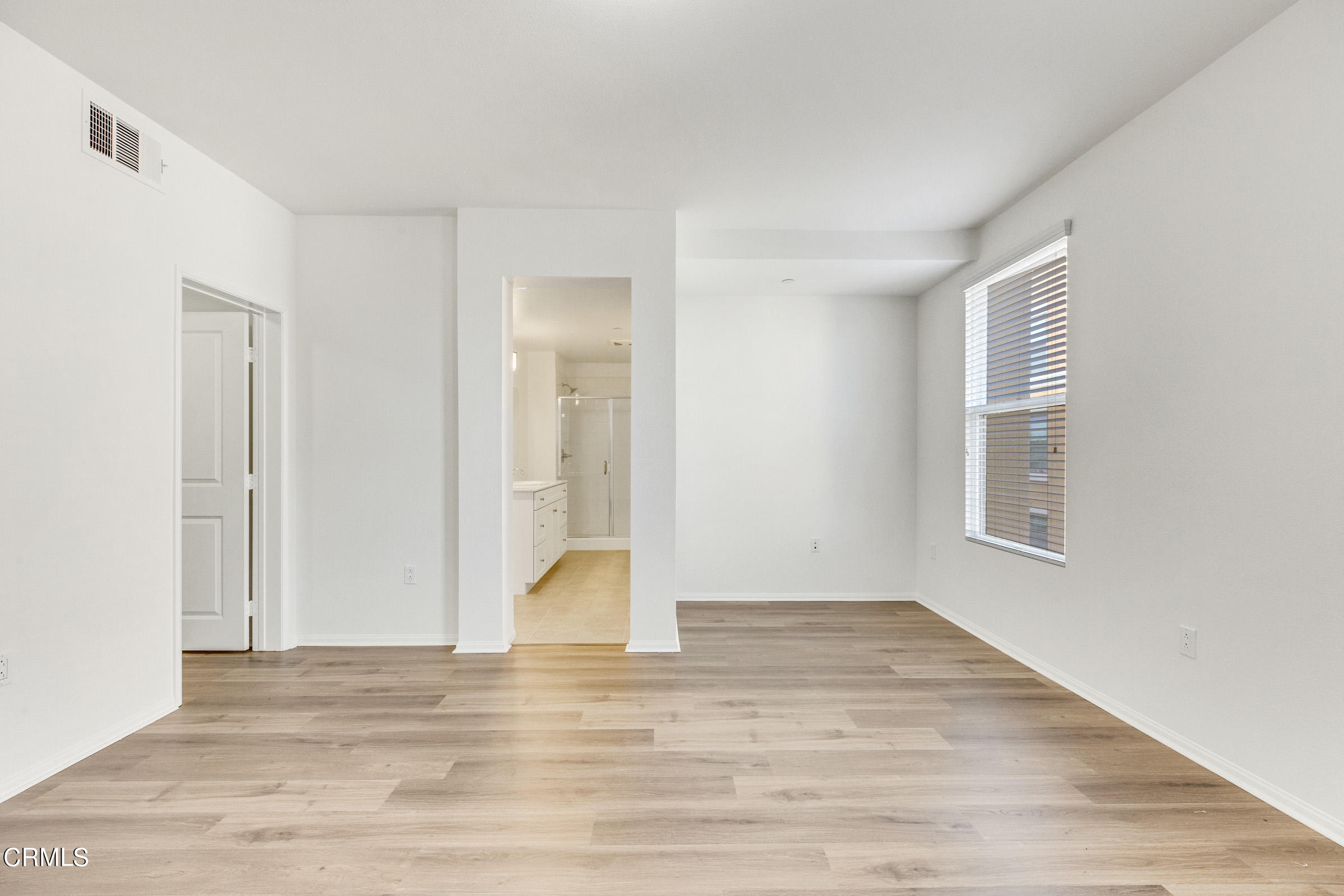 410 West Main Street, Unit 231 Alhambra, CA 91801 - Photo 38 of 45 a view of an empty room with wooden floor and a window