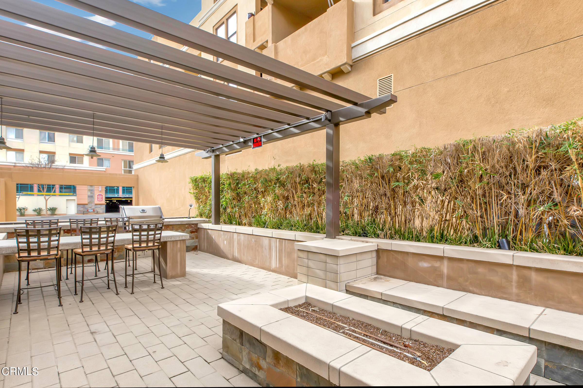 410 West Main Street, Unit 231 Alhambra, CA 91801 - Photo 41 of 45 a view of a patio with a table chairs and a wooden deck