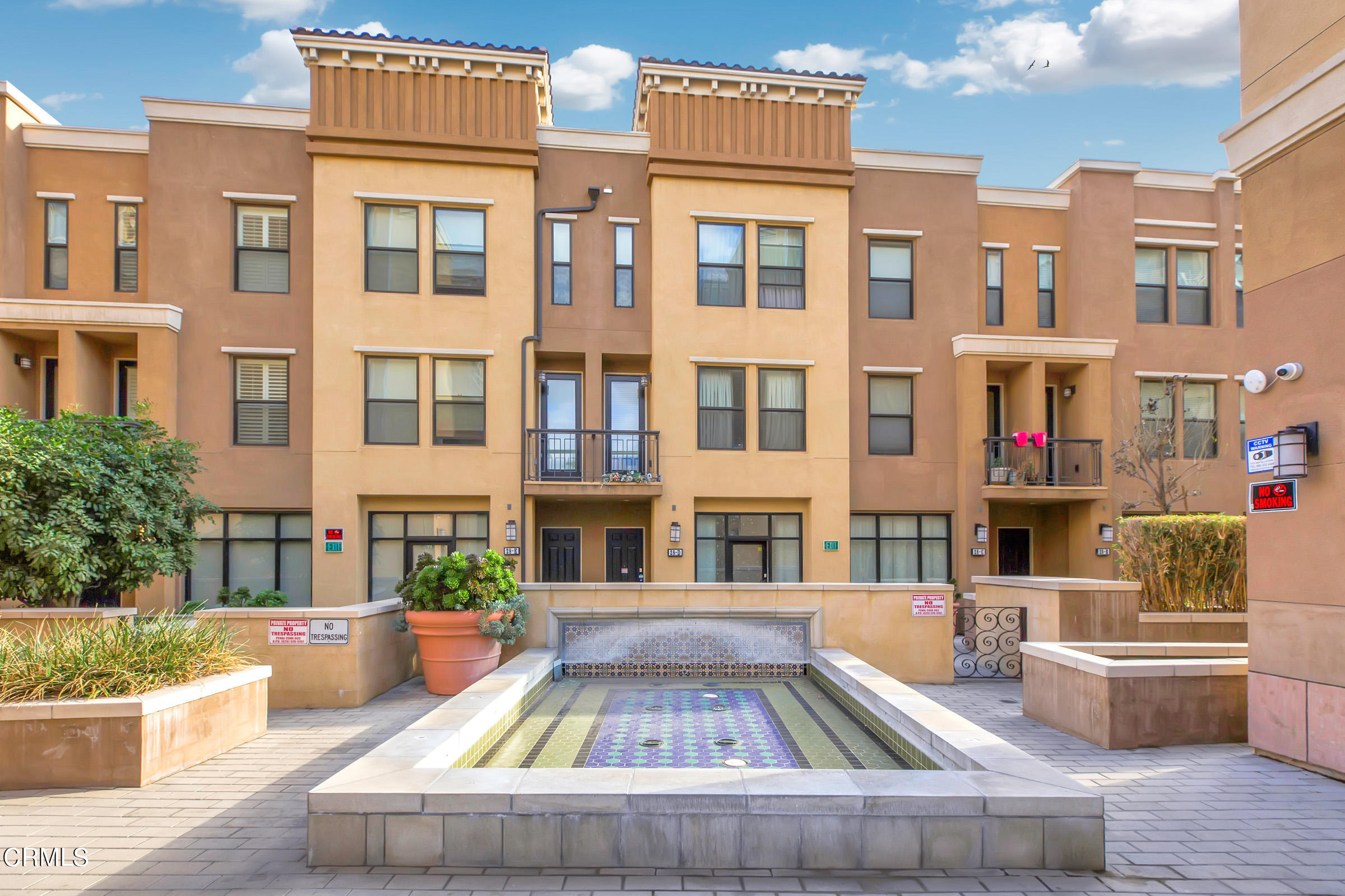 410 West Main Street, Unit 231 Alhambra, CA 91801 - Photo 42 of 45 a front view of a residential apartment building with a yard