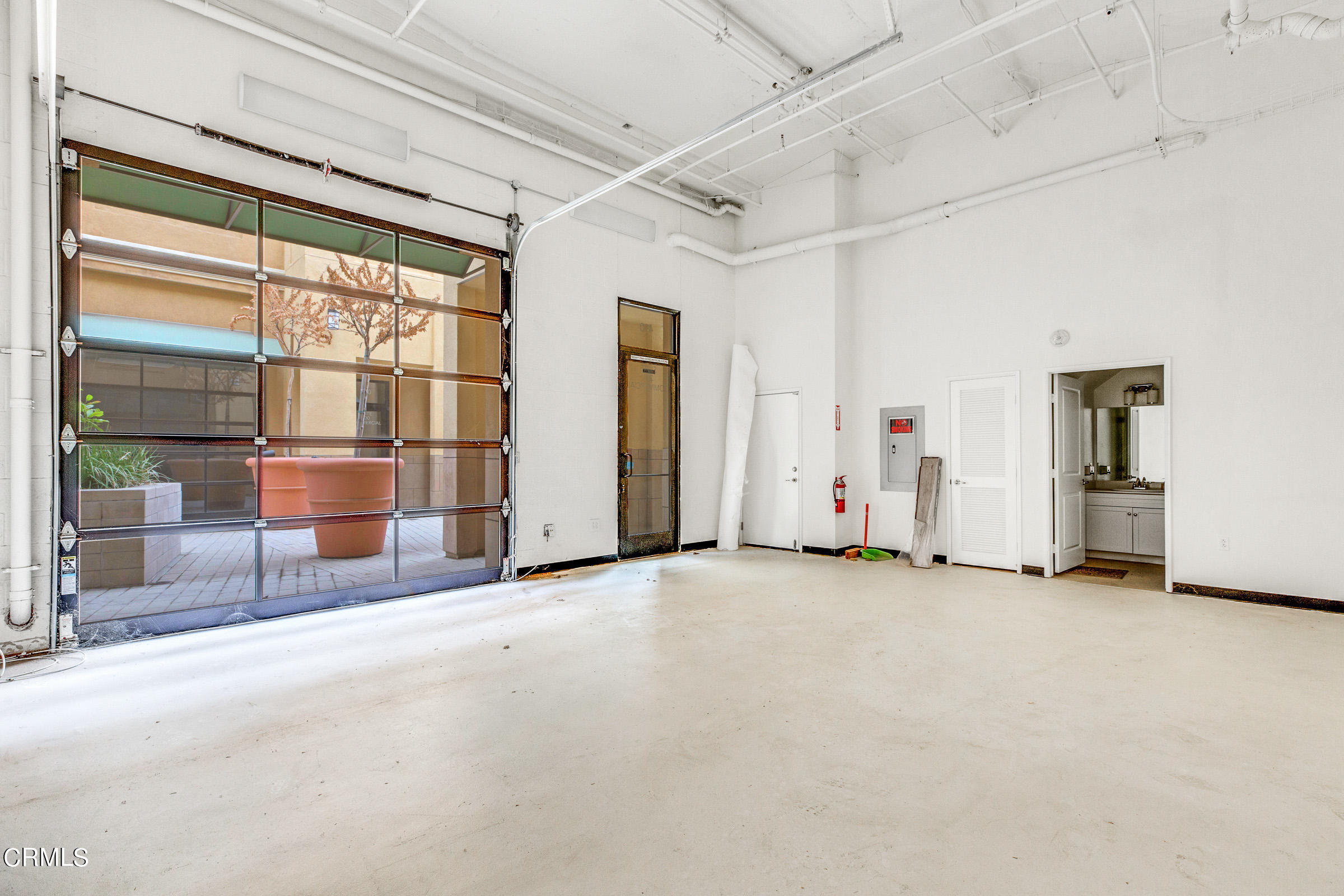 410 West Main Street, Unit 231 Alhambra, CA 91801 - Photo 7 of 45 an empty room with fireplace and windows